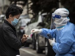 БНХАУ-д ковидын цар тахлын дэгдэлтийн улмаас хөл хөдөлгөөн хязгаарлагдмал байна 